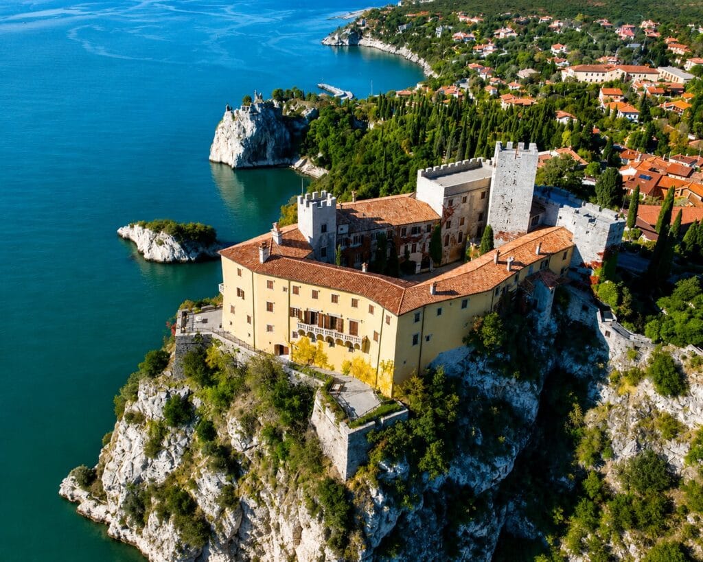 Aerial view of Duino Castle on the cliffs above the Adriatic Sea near Trieste, where Rainer Maria Rilke stayed in 1911–1912 and began writing the Duino Elegies.