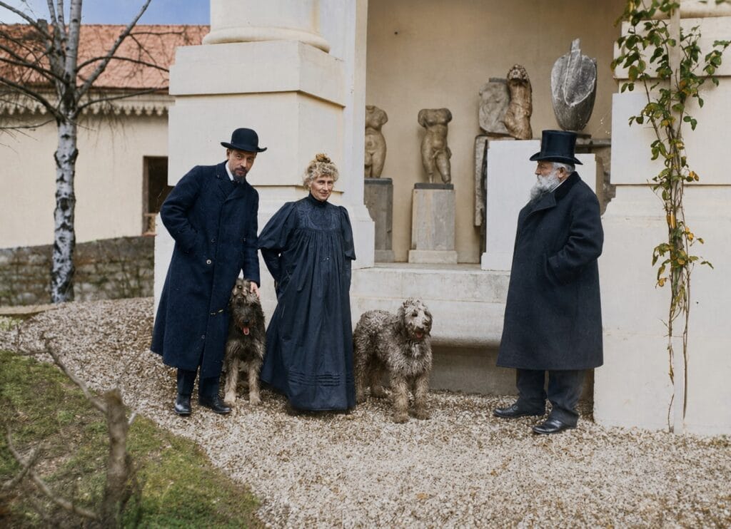 Rainer Maria Rilke, Rose Beuret, and Auguste Rodin with two dogs in the garden of Rodin's residence at Meudon. Photograph by Albert Harlingue. Collection of the Musée Rodin.
